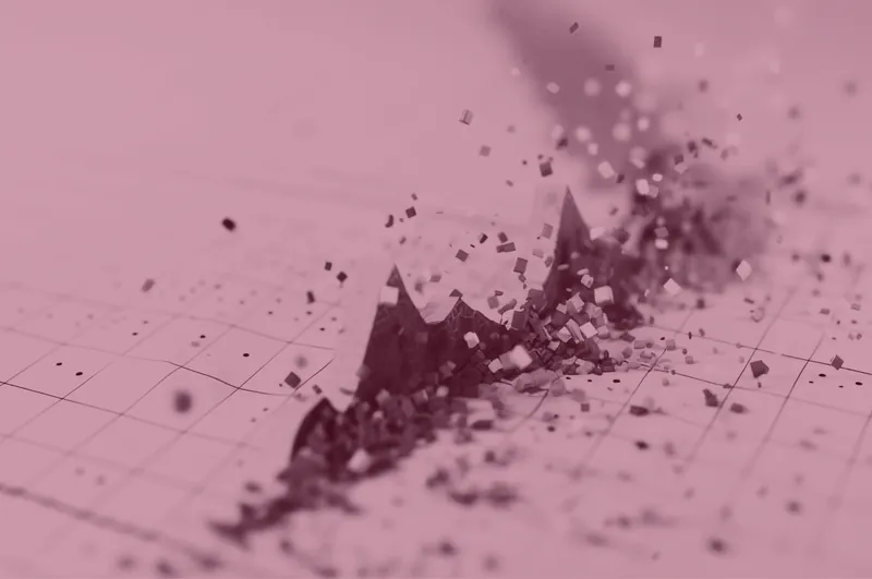 Red-tinted abstract image of a financial chart breaking apart into particles.